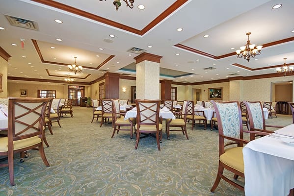 Dining area with tables and chairs in a well-lit space
