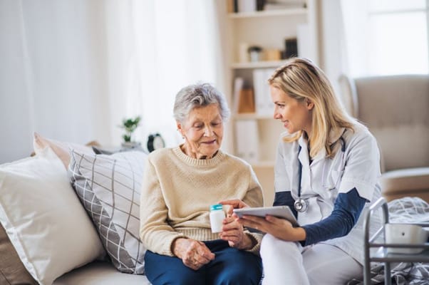 Healthcare professional engaging with a senior resident