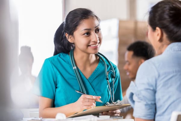 Nurse interacting with a resident in a care setting