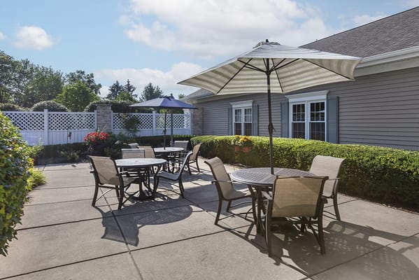 Outdoor seating area with umbrellas and flowers