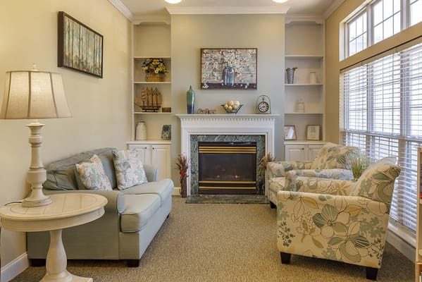 Comfortable lounge area with a fireplace and seating