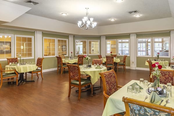 Dining area set for a meal with floral decor