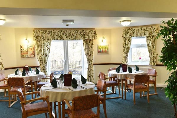 Dining room setup with tables and chairs