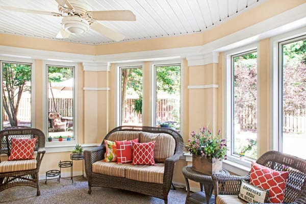 Bright sunroom with seating and plants