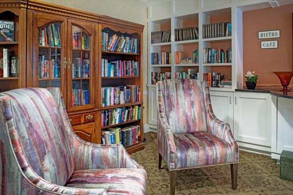 Cozy reading area with bookshelves and chairs