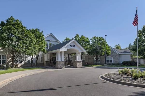 Exterior view of Brookdale Eagan with entrance and trees