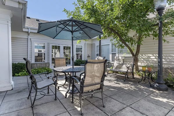 Outdoor patio area with seating and trees