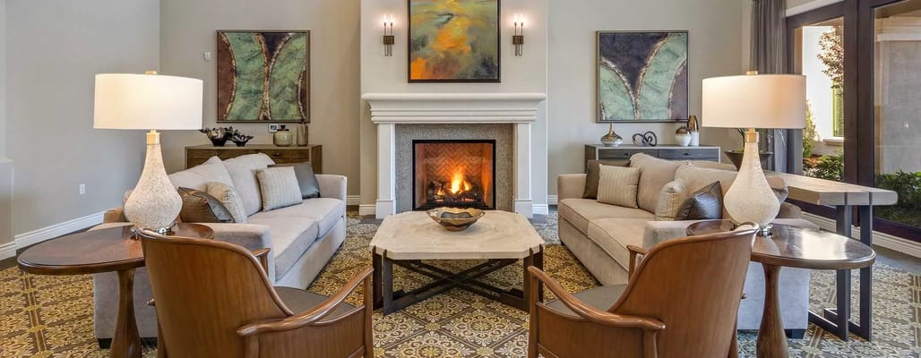 Cozy lounge area with fireplace and comfortable seating