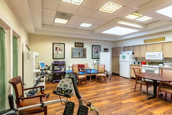 Bright interior space with exercise equipment and seating