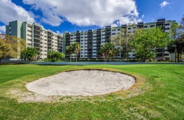 Outdoor view of a senior living facility with golf area