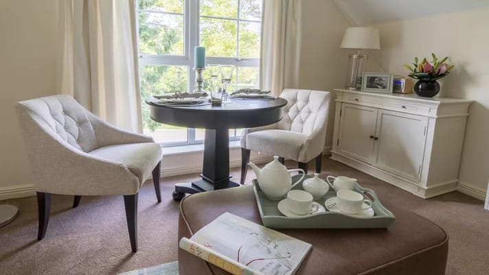 A cozy interior sitting area with a table