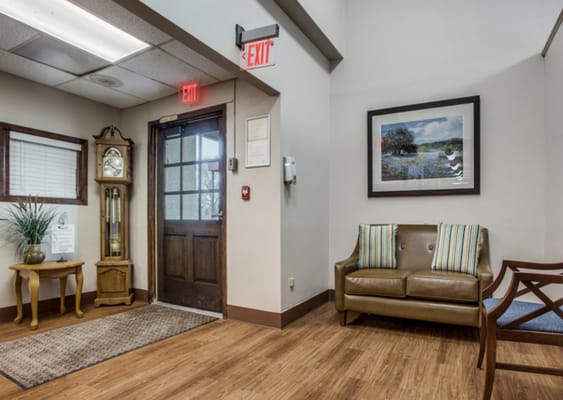 Interior corner of a lobby with seating and clock