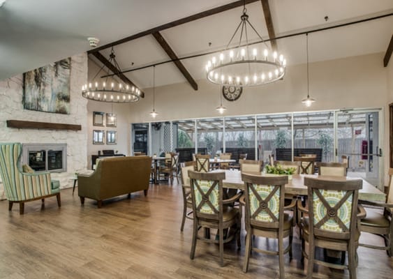 Bright and welcoming common area with seating and tables