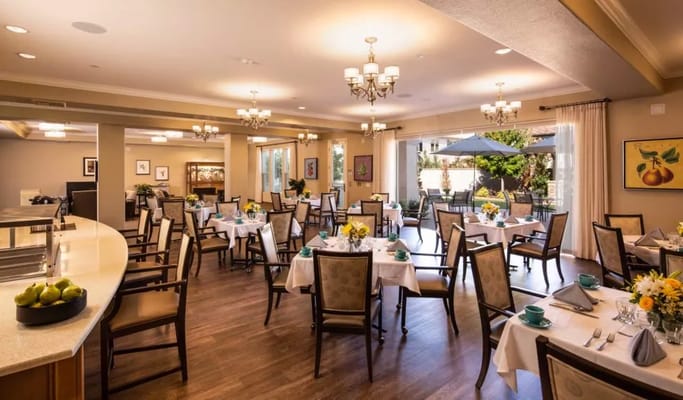 Dining area with tables set for residents