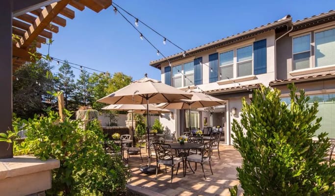 Outdoor seating area with umbrellas and tables