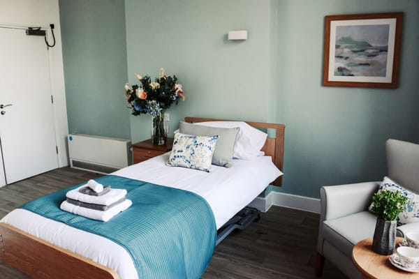 Cozy resident room with floral decor and fresh linens