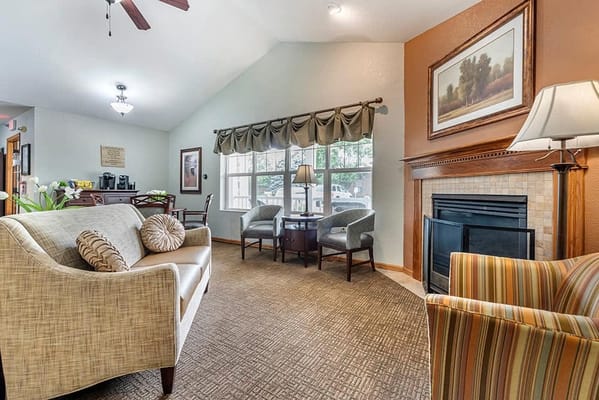 Cozy common area with seating and a fireplace