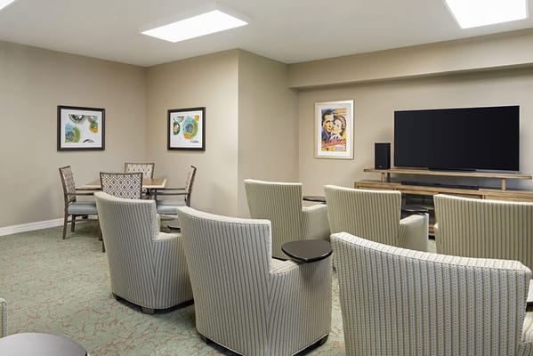 Common area with comfortable seating and a television.