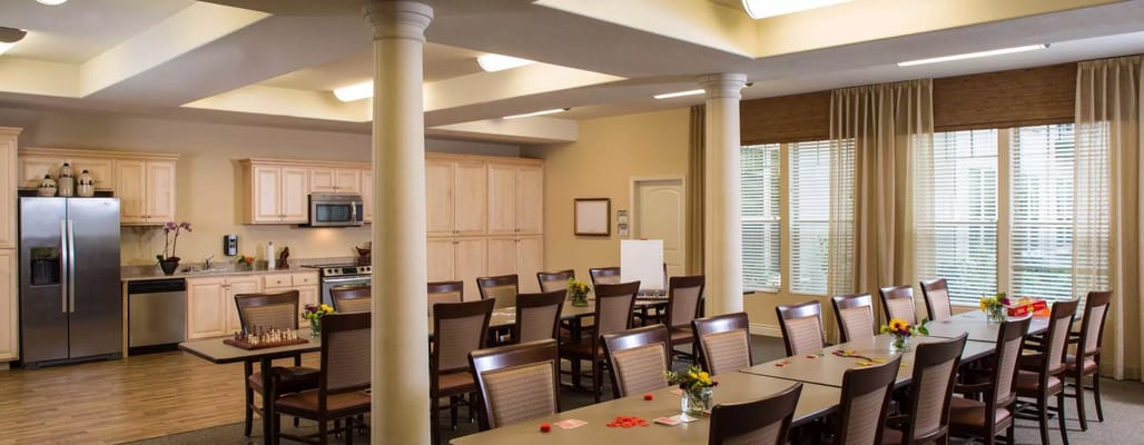 Bright dining room with tables set for meals