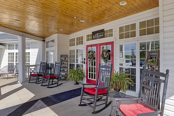 Welcoming entrance with rocking chairs and seasonal decor