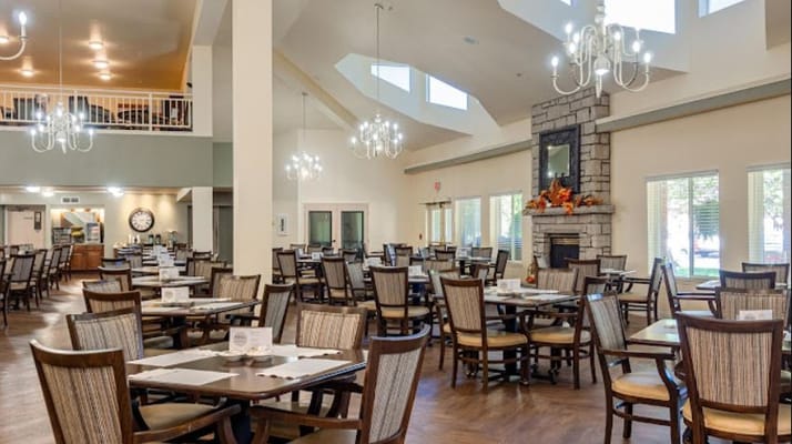 Spacious dining area with wooden tables and chairs