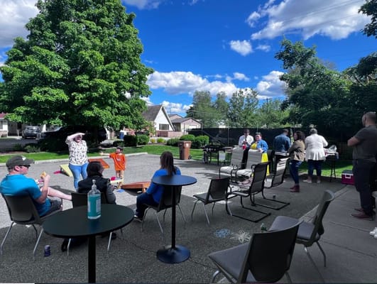Residents enjoying an outdoor gathering on a sunny day