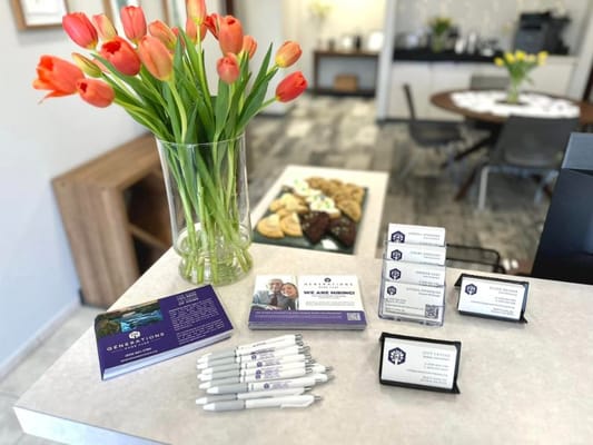 Interior space with flowers, brochures, and cookies