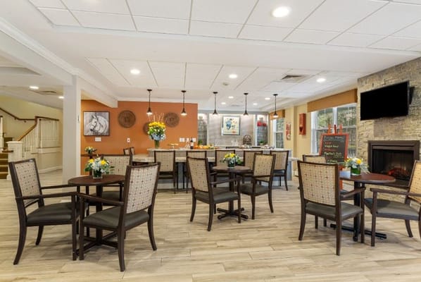 Cozy dining area with tables and floral centerpieces
