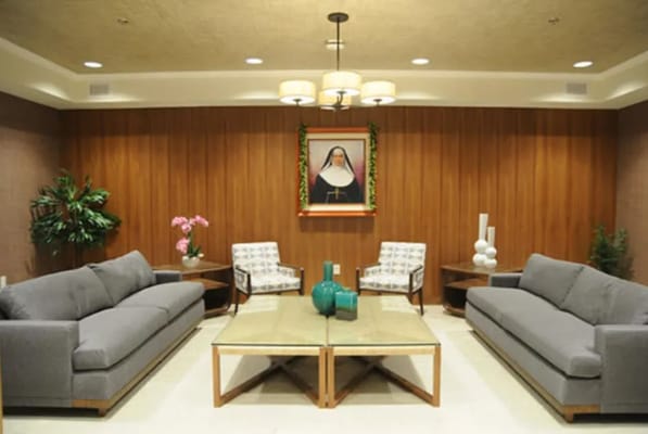 A cozy common area with seating and plants