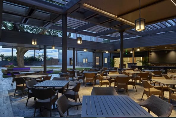 Outdoor dining area with tables and chairs