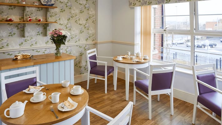 Cozy dining area with tables and tea set