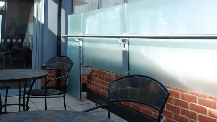 Outdoor seating area with tables and chairs