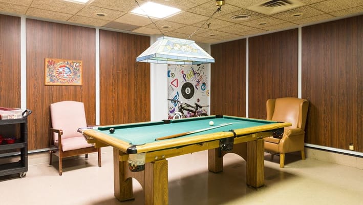 Game room with a billiards table and seating