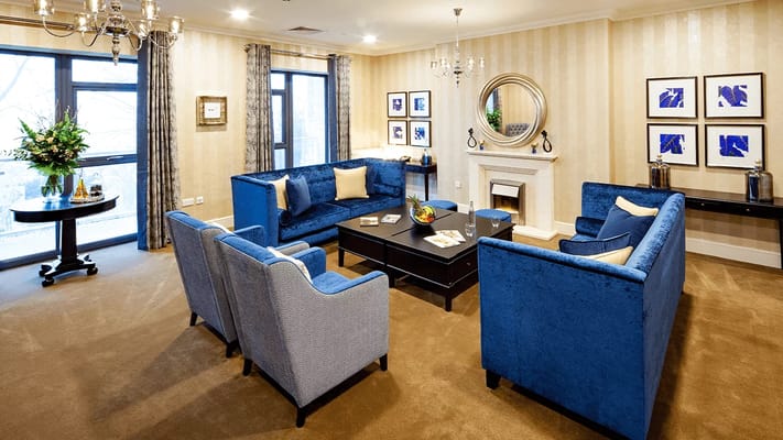 Bright and inviting common area with blue sofas
