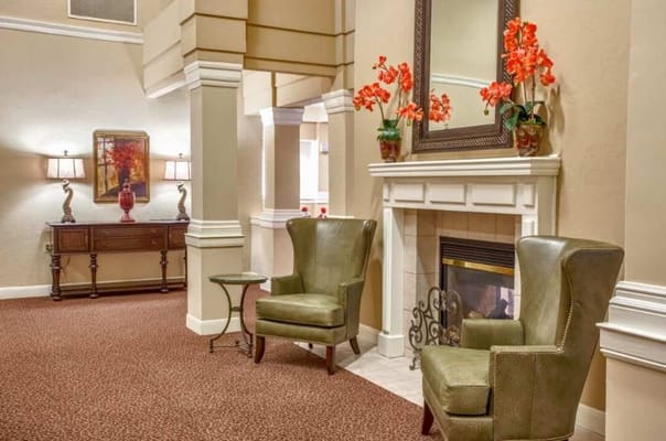 Cozy lobby area with seating and decorative flowers