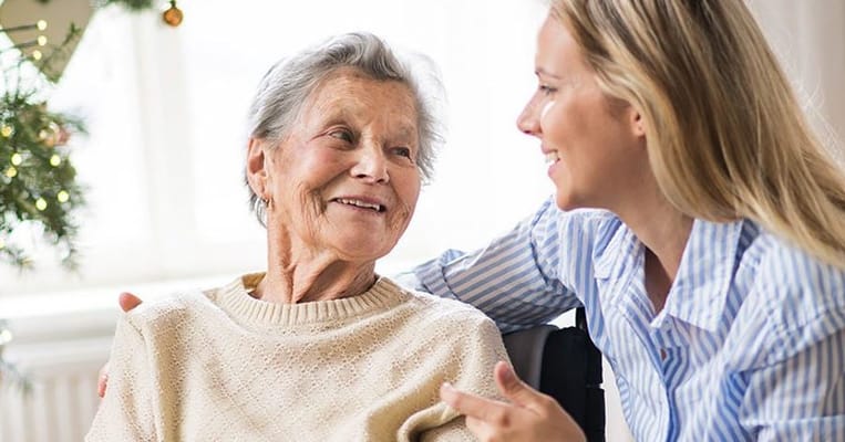 Caregiver interacting with a senior resident