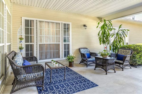 Outdoor seating area with comfortable furniture and plants