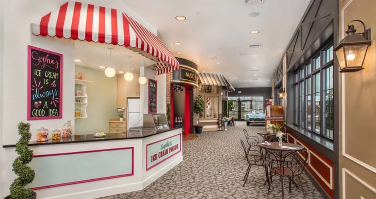 Brightly decorated ice cream parlor with striped awnings