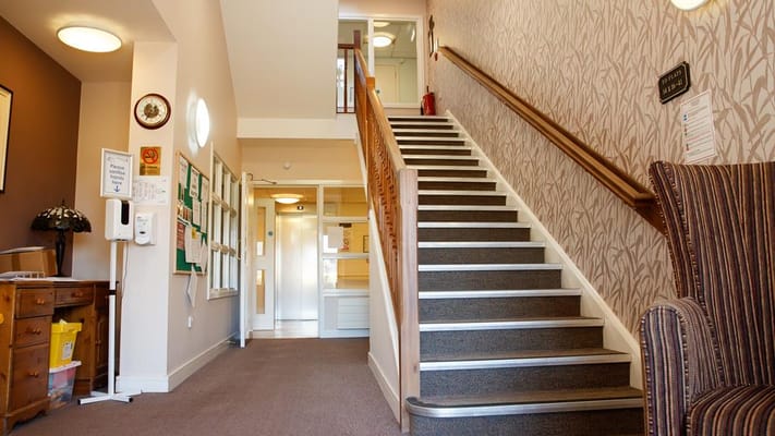 Interior view of a facility's stairway and lobby area