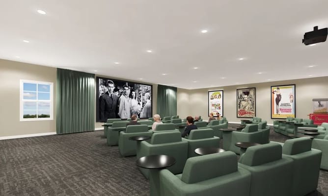 Residents enjoying a movie in a common area