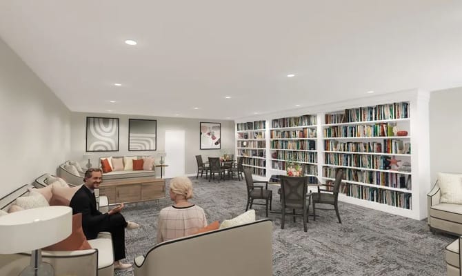 Interior common area with residents and bookshelves