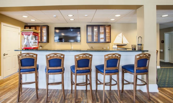 Bright common area with seating and a snack bar