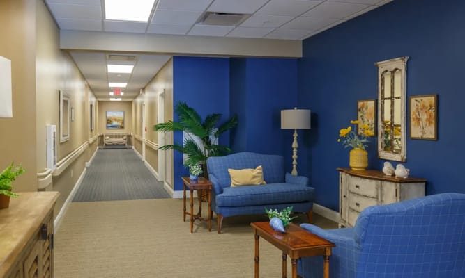 Bright interior corridor with seating area and decor