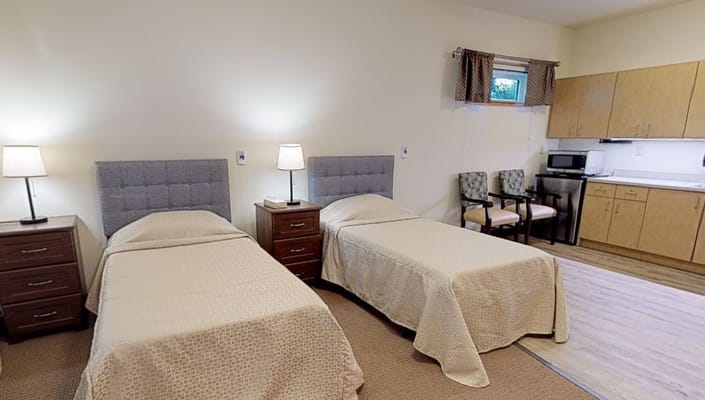 Bright private room with twin beds and kitchenette