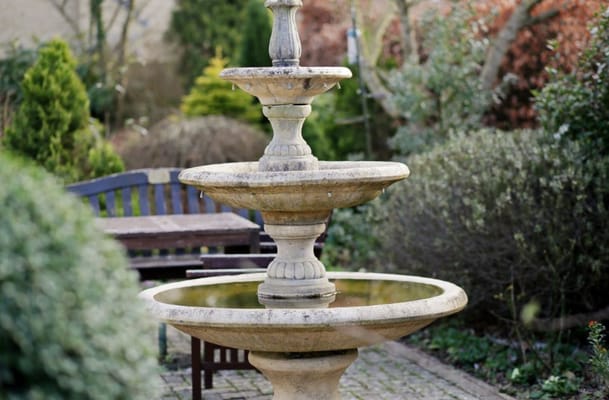 A decorative fountain in a garden area