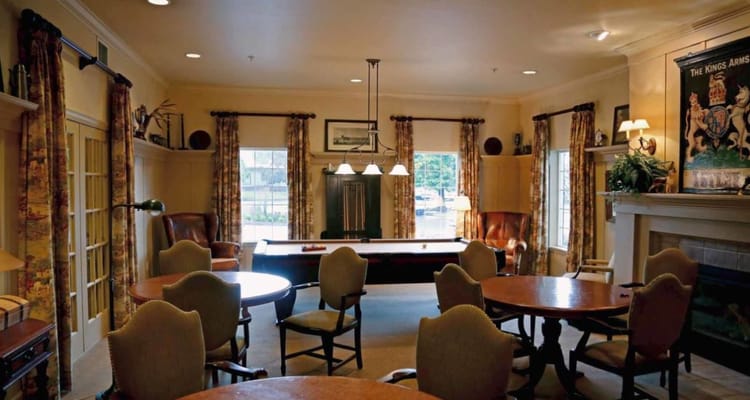 Interior view of game room with tables and seating