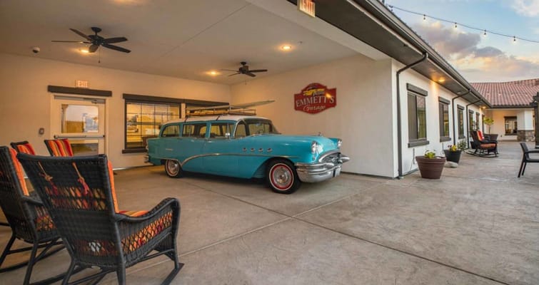 Vintage blue car parked outside Emmett's Garage