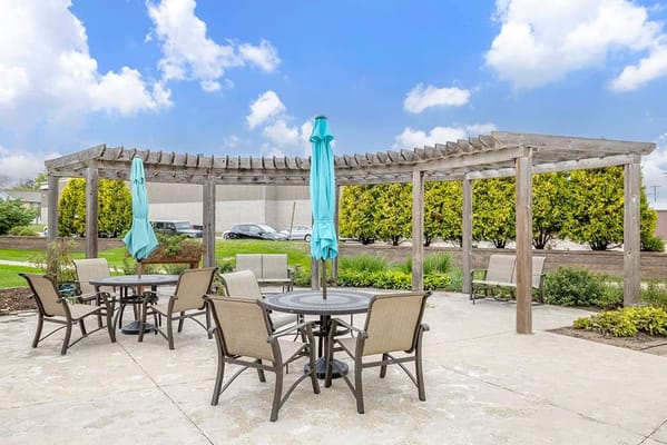 Outdoor patio area with seating and umbrellas