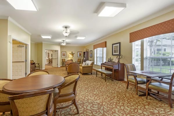 Bright common area with seating and windows