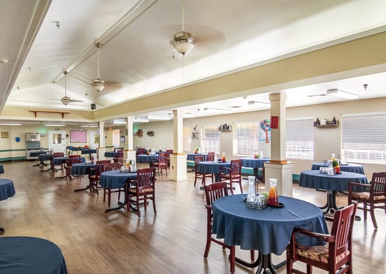 Interior view of a dining area with tables and chairs